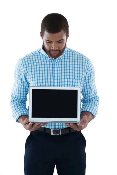 Male executive holding laptop — Stock Photo, Image