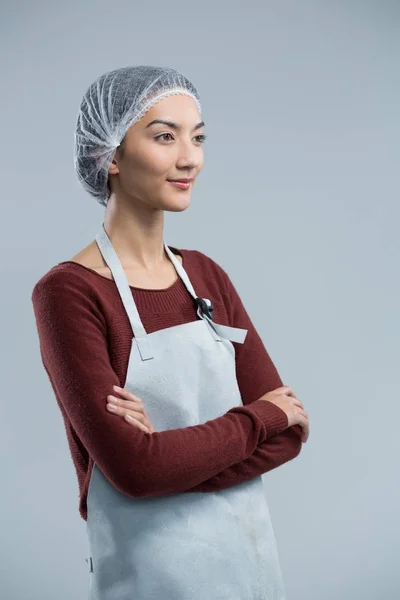 Female chef standing with arms crossed — Stock Photo, Image
