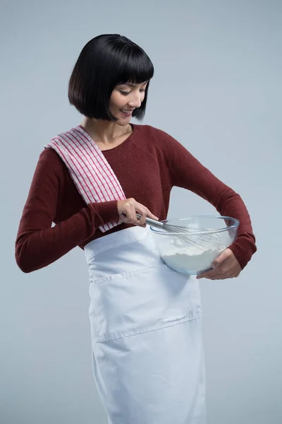 Chef mixing flour in bowl with whisk — Stock Photo, Image