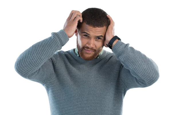 Confused man against white background — Stock Photo, Image