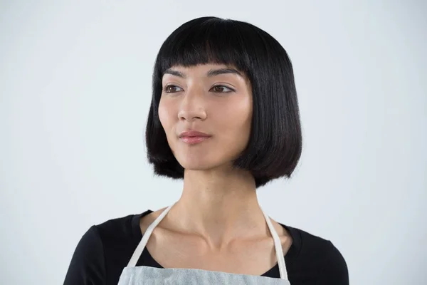 Waitress standing against white background — Stock Photo, Image
