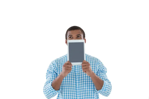 Executive hiding his face with tablet — Stock Photo, Image