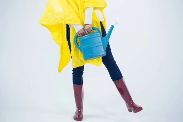 Woman in yellow raincoat — Stock Photo, Image