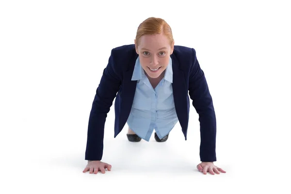 Businesswoman performing push ups — Stock Photo, Image