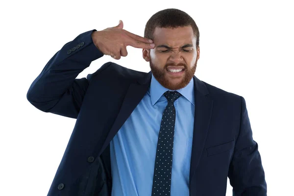 Businessman making gun gesture — Stock Photo, Image