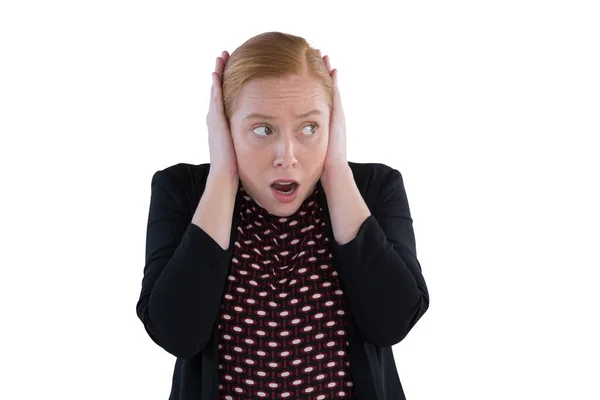 Scared woman covering her ears — Stock Photo, Image