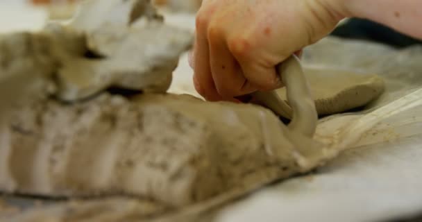 Artist molding a clay at table — Stock Video