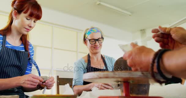 Artist molding clay at table — Stock Video