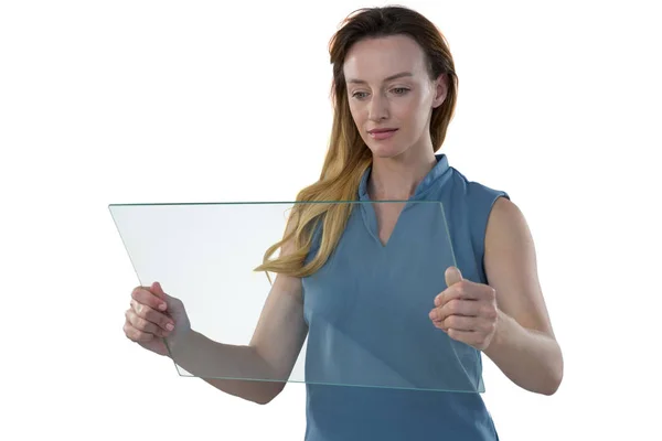 Female executive using glass tablet — Stock Photo, Image