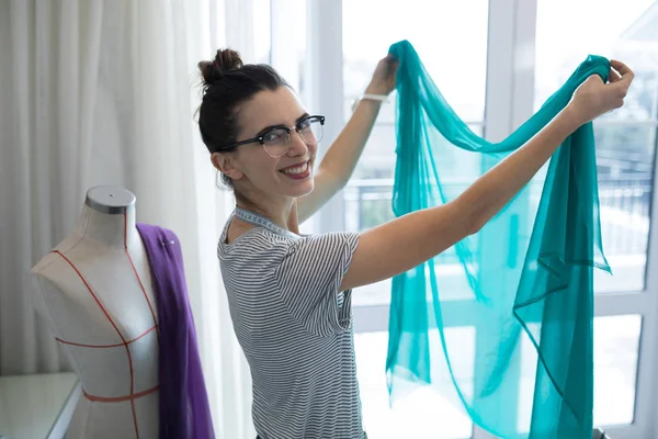 Fashion designer designing a fabric textile — Stock Photo, Image