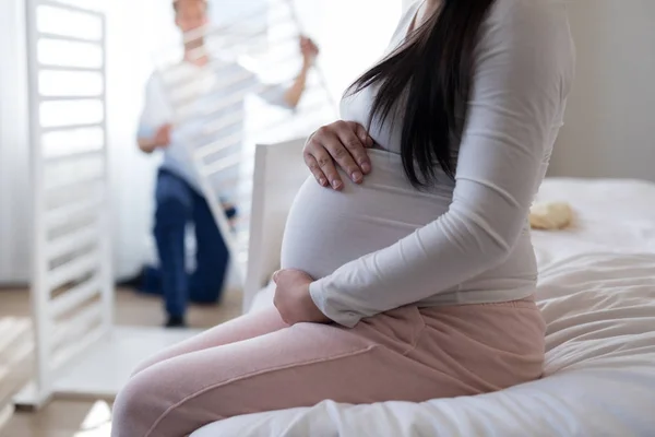 Woman feeling presence of baby in stomach — Stock Photo, Image