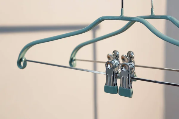Empty cloth hanger with clothes peg — Stock Photo, Image