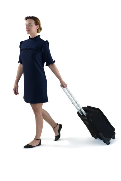 Female executive walking with suitcase — Stock Photo, Image