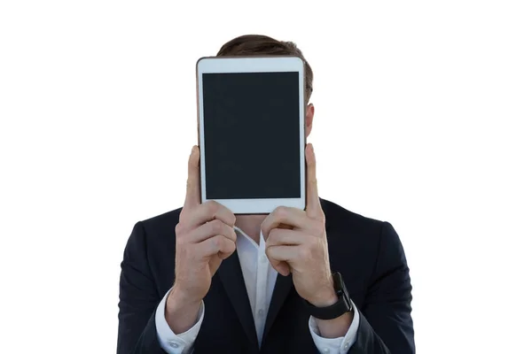 Businessman hiding his face with tablet — Stock Photo, Image