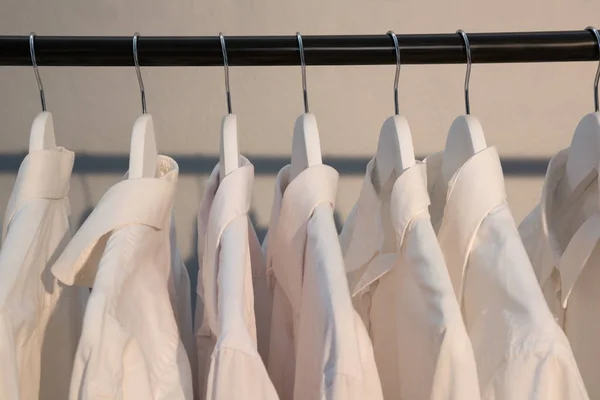 Shirts hanging on cloth hanger — Stock Photo, Image