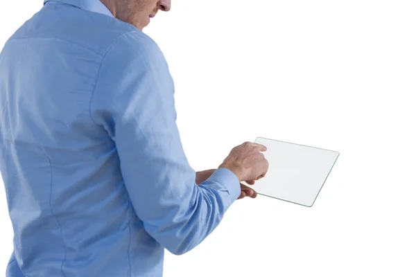 Male executive using glass digital tablet — Stock Photo, Image