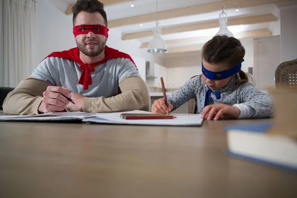 Father and son pretending to be superhero — Stock Photo, Image