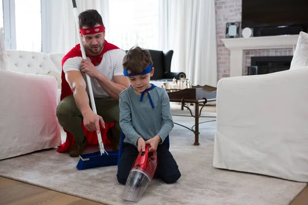 Father and son pretending to be superhero — Stock Photo, Image