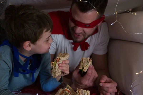 Father and son pretending to be superhero — Stock Photo, Image