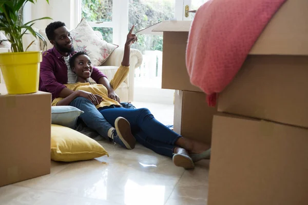 Couple relaxing in new house — Stock Photo, Image