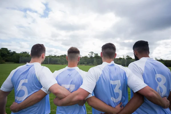 Joueur de football avec bras autour — Photo