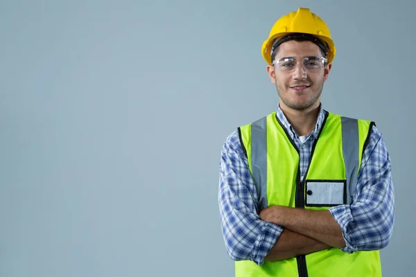 Male architect standing with arms crossed — Stock Photo, Image