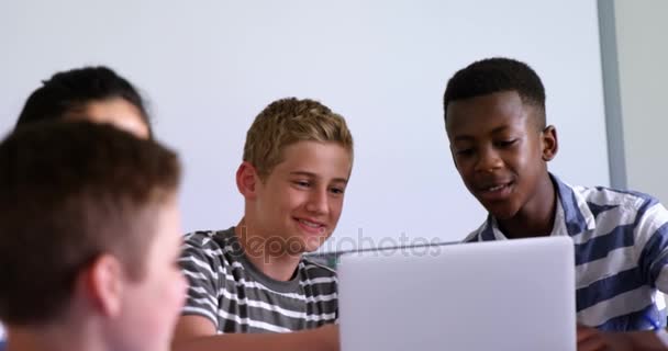 Schoolkids using laptop — Stock Video