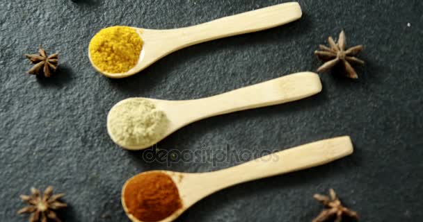 Spices in wooden spoons — Stock Video