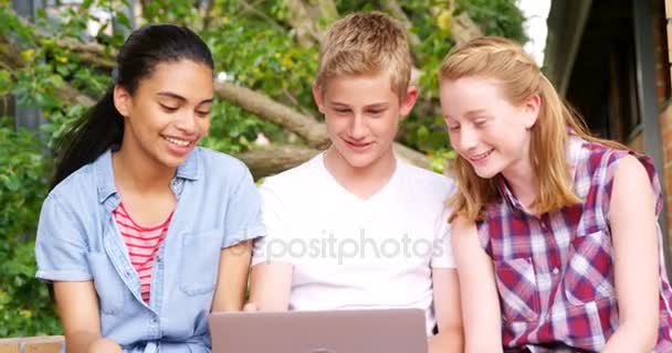 Schoolkids using laptop — Stock Video