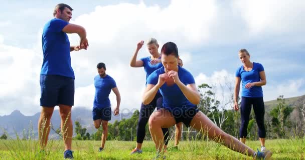 Fit people exercising in boot camp — Stock Video