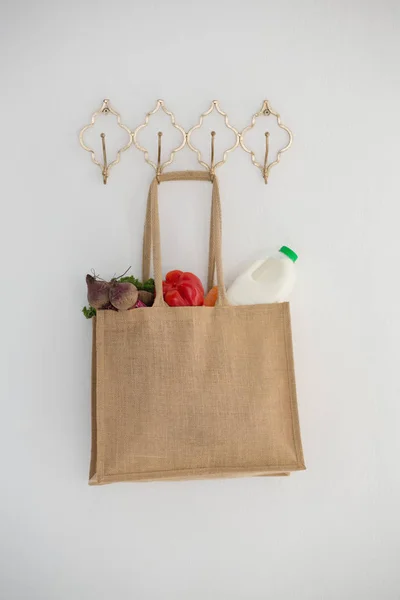Fresh vegetables and bottle in bag — Stock Photo, Image