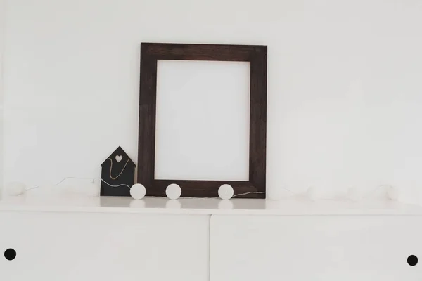 Picture frame with decorations on table — Stock Photo, Image