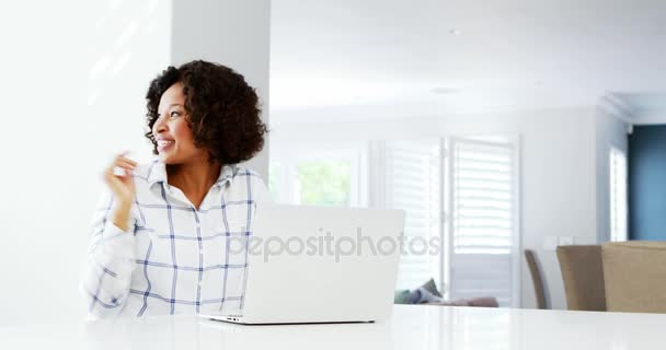 Couple using laptop at home — Stock Video