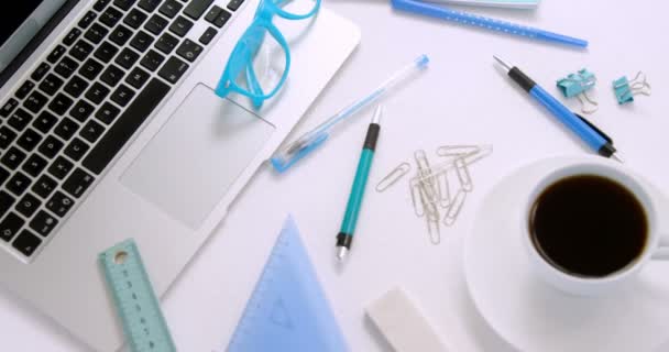 Laptop Spectacles Pen Coffee Paper Clip Scale Set Square Headphones — Stock Video