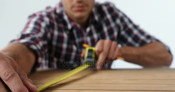 Close Male Architect Measuring Wooden Plank Tape Measure White Background — Stock Video