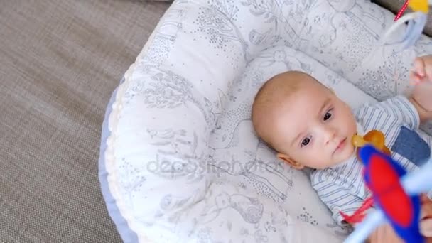 Cute Little Baby Lying Crib Mother Putting Pacifier Mouth Home — Stock Video