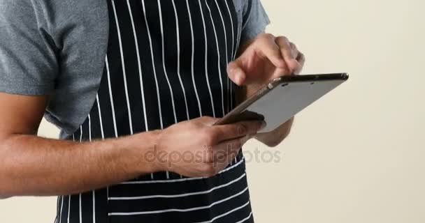 Smiling Waiter Standing Using Digital Tablet White Background — Stock Video