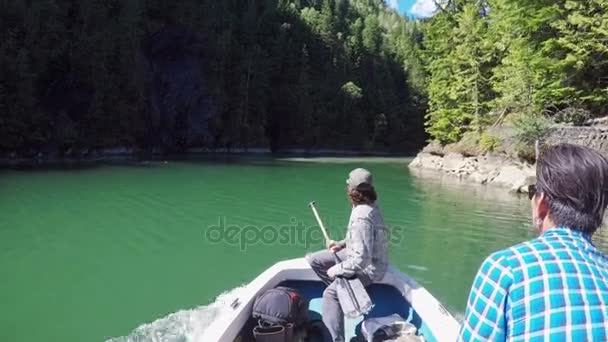 Two Men Riding Fishing Boat River Surrounded Forest — Stock Video