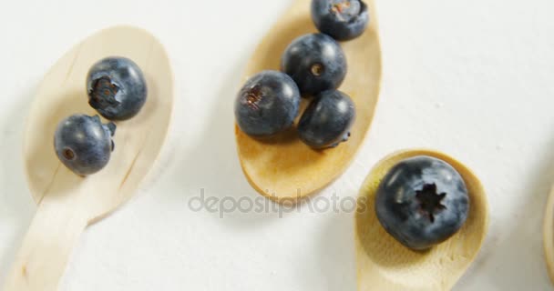 Close Blueberries Wooden Spoon Placed White Surface — Stock Video