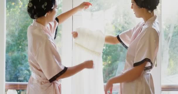 Excited Bridesmaids Holding Wedding Dress Home — Stock Video