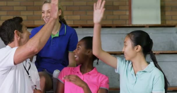 Volleyball Coach Giving High Five Female Players Court — Stock Video