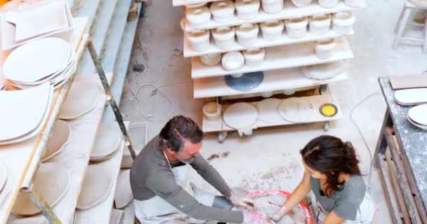 High Angle View Male Potter Assisting Female Potter — Stock Video