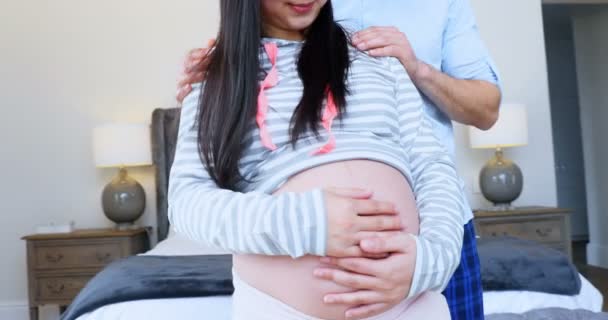 Pregnant Couple Embracing Each Other Bedroom Home — Stock Video