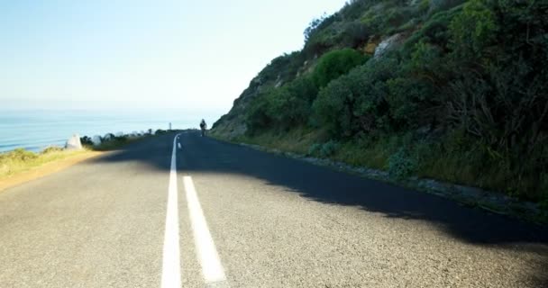 Young Female Cyclist Cycling Countryside Road — Stock Video