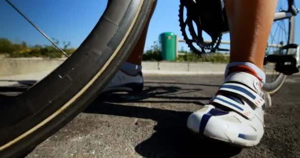 Low section of female cyclist cycling on a countryside road 4k — Stock Footage Low Section Female Cyclist Cycling Countryside Road Royalty Free Stock Footage