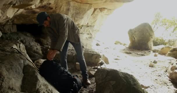 Male Hiker Standing Backpack Cave Countryside — Stock Video