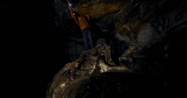 Male Hiker Exploring Dark Cave Countryside — Stock Video