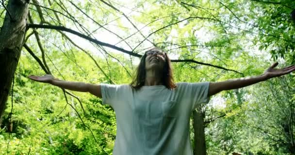 Mature Woman Standing Arms Outstretched Garden Sunny Day — Stock Video