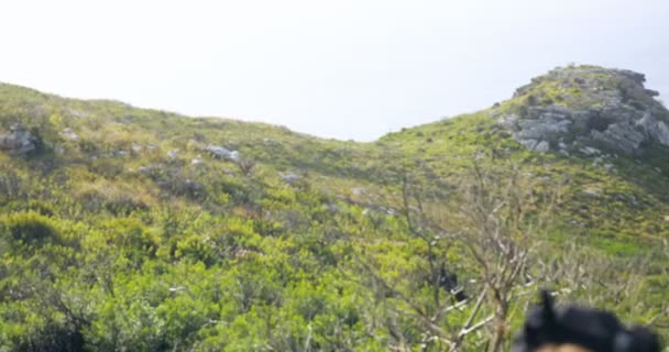 Male Hiker Shielding Eyes While Walking Countryside Sunny Day — Stock Video