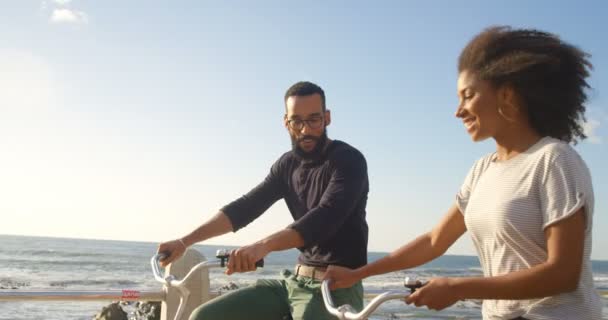 Couple Interacting Each Other While Cycling Beach — Stock Video